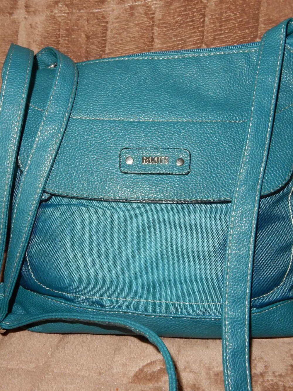 Roots teal crossbody